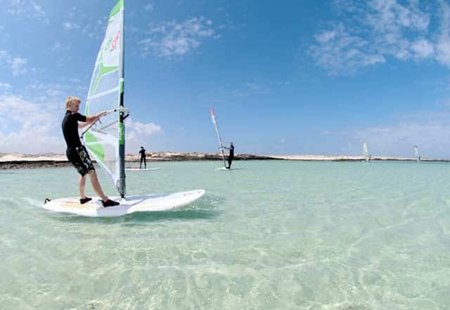 A windsurfing lesson Fuerteventura for beginners directly in the water