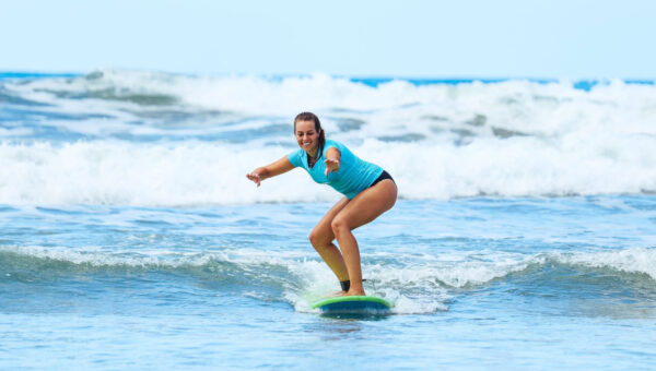 Surf students learn to surf in the Costa Rica surf school week