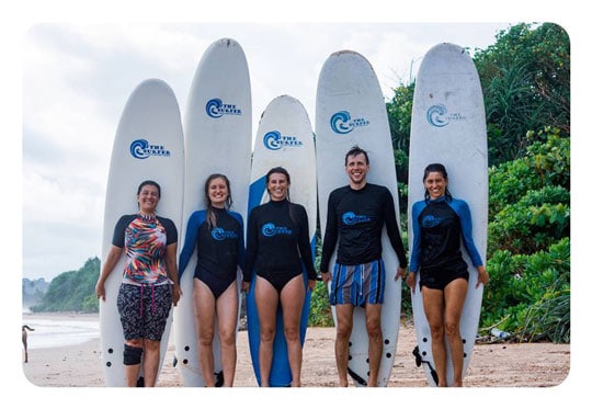 A group photo of a surf lesson in Sri Lanka