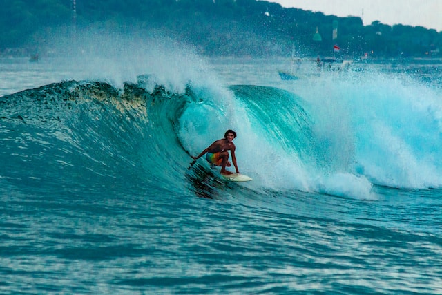 Both beginners and pros can surf in Bali.